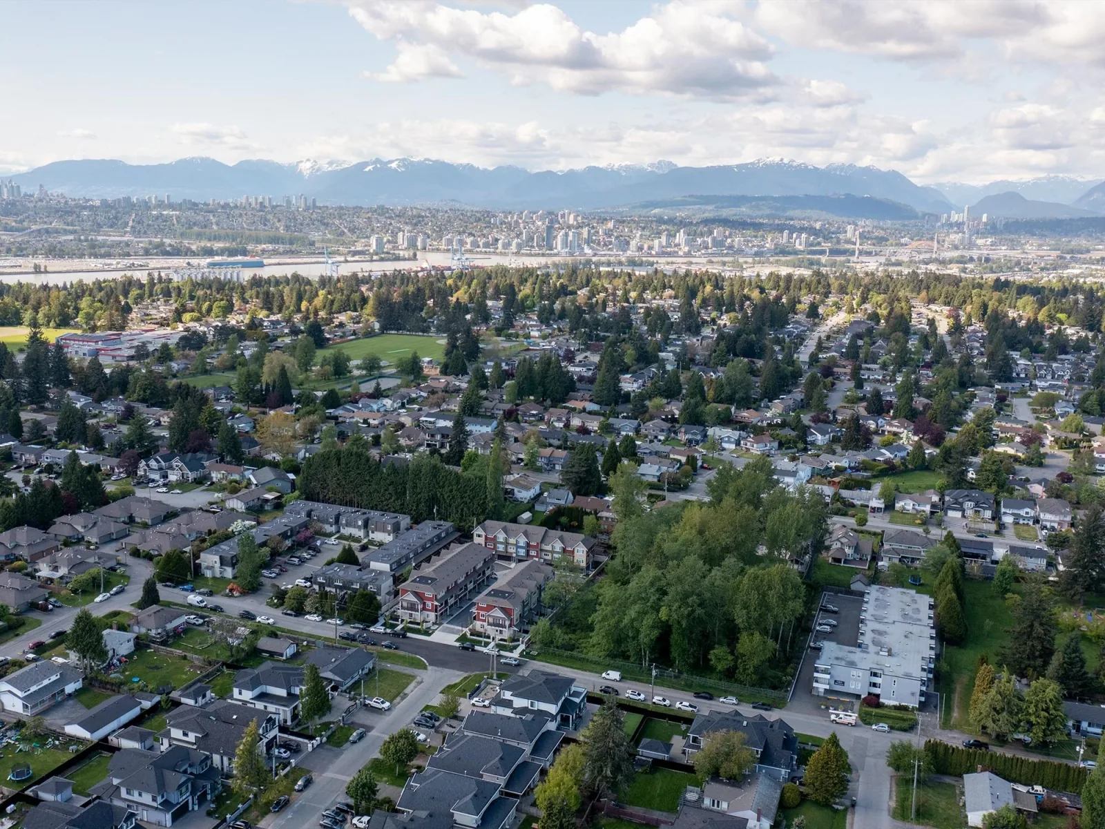 Aerial view over north Surrey homes toward the Fraser River