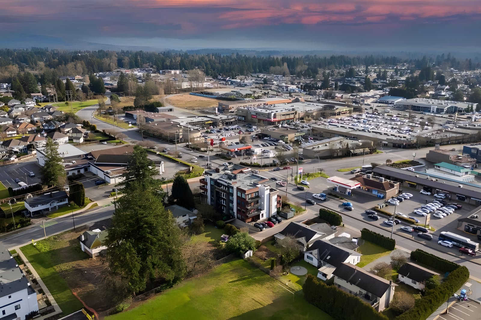 Aerial view over northwest Maple Ridge toward the town centre at sunset