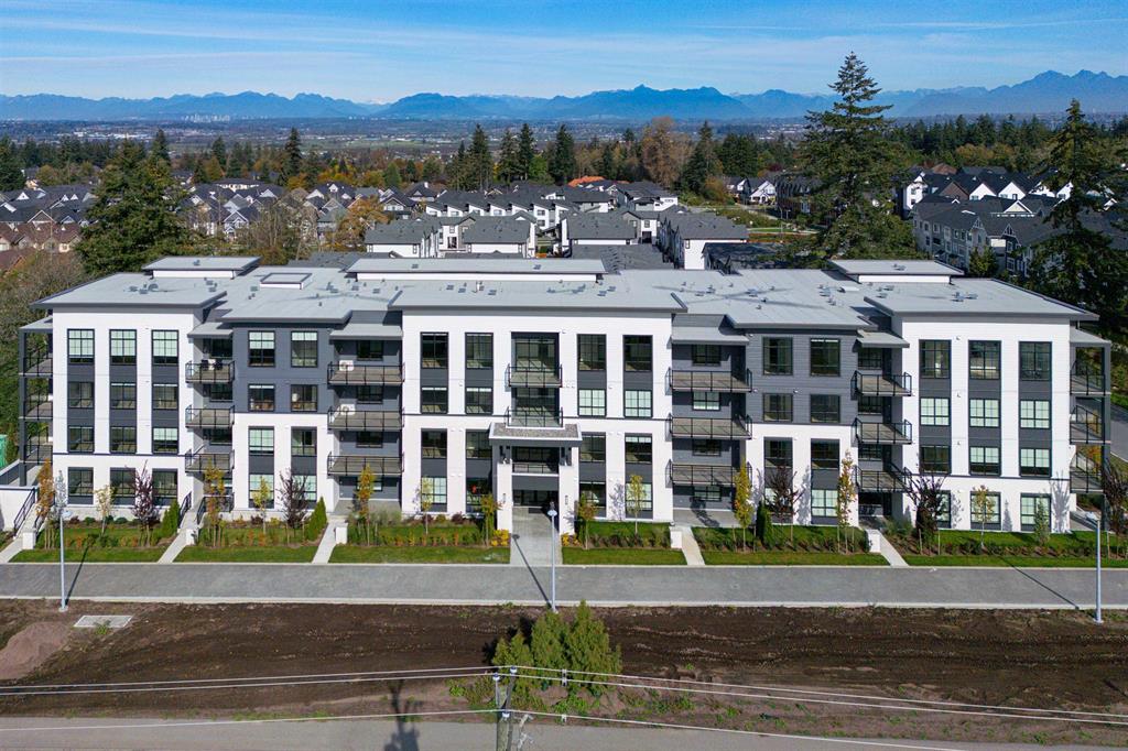 Aerial view of condo buildings in Sullivan, Surrey, with the mountains behind
