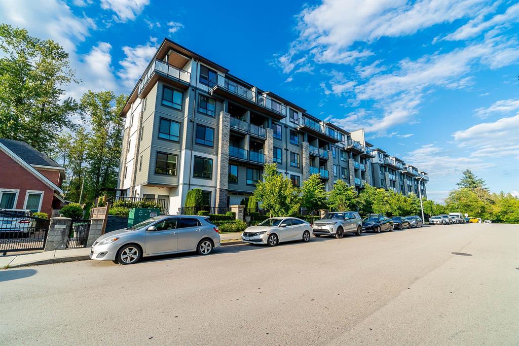Mid-rise condo buildings along a street in Guildford, Surrey