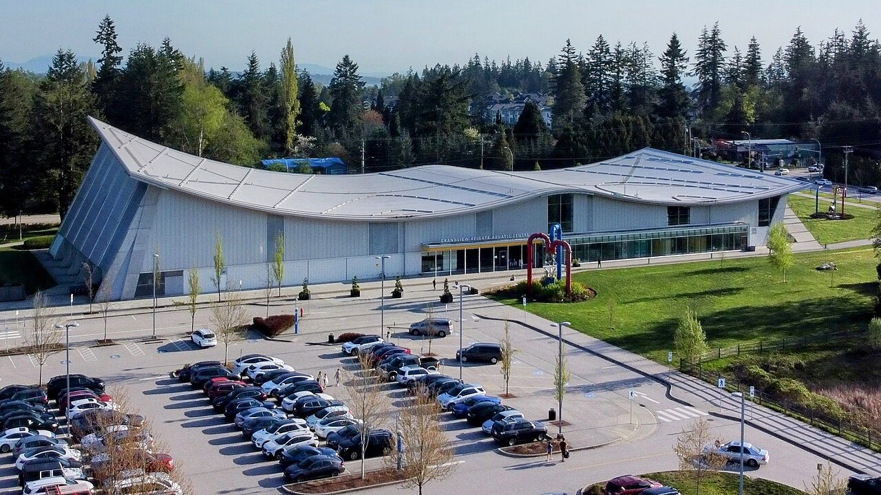 Aerial view of the Grandview Heights Aquatic Centre and its wave-shaped roof in South Surrey