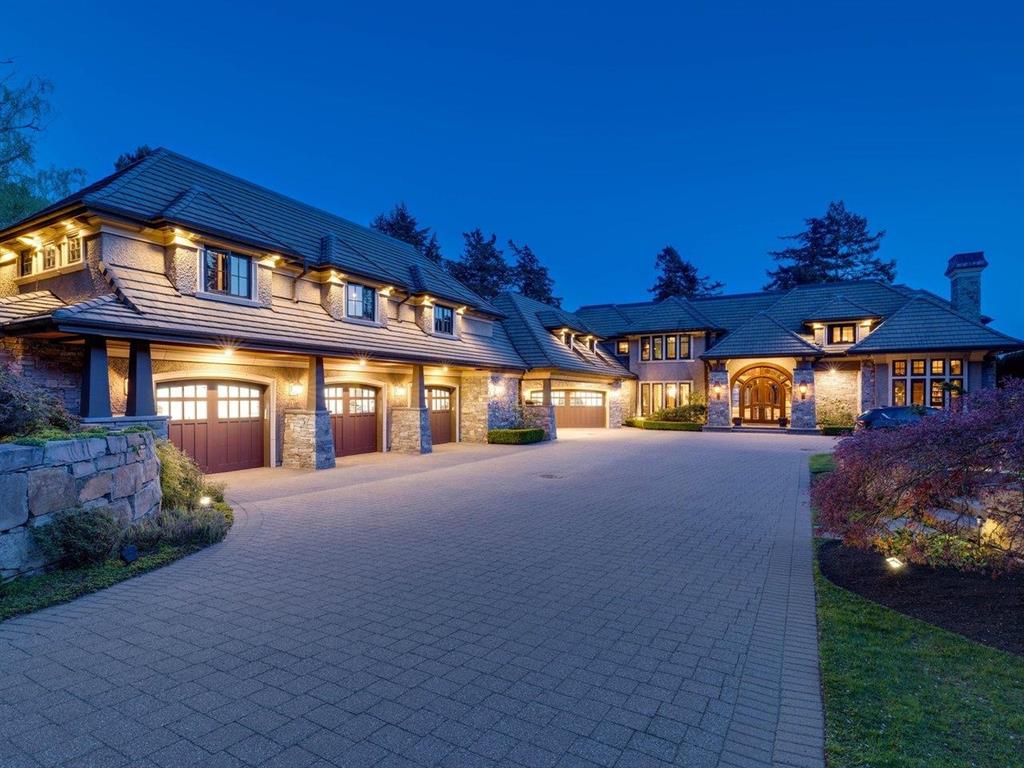 A large detached home at dusk in White Rock