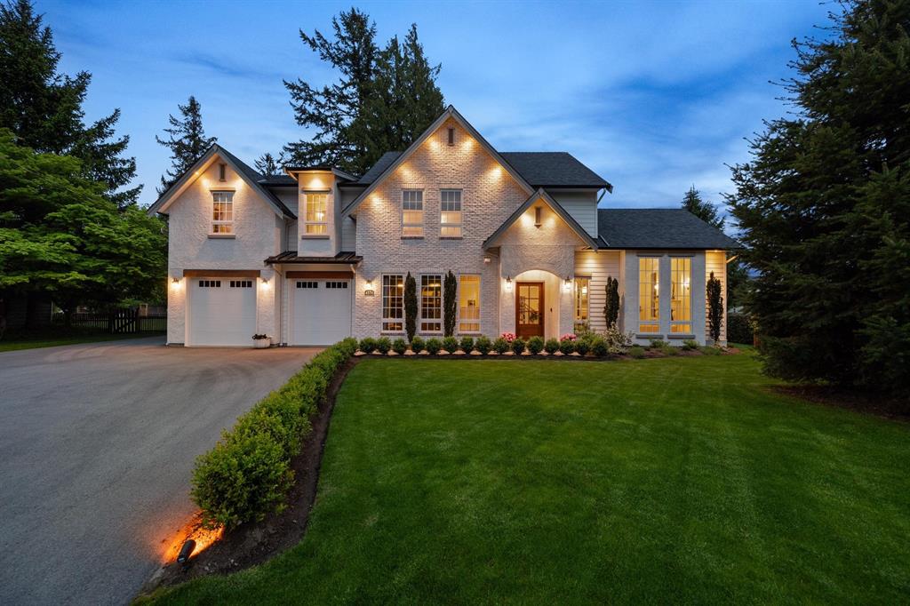 A detached home with a large lawn in Salmon River, Langley