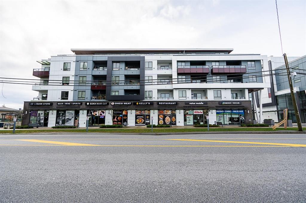 Mixed-use condo building with street-level shops in East Newton, Surrey