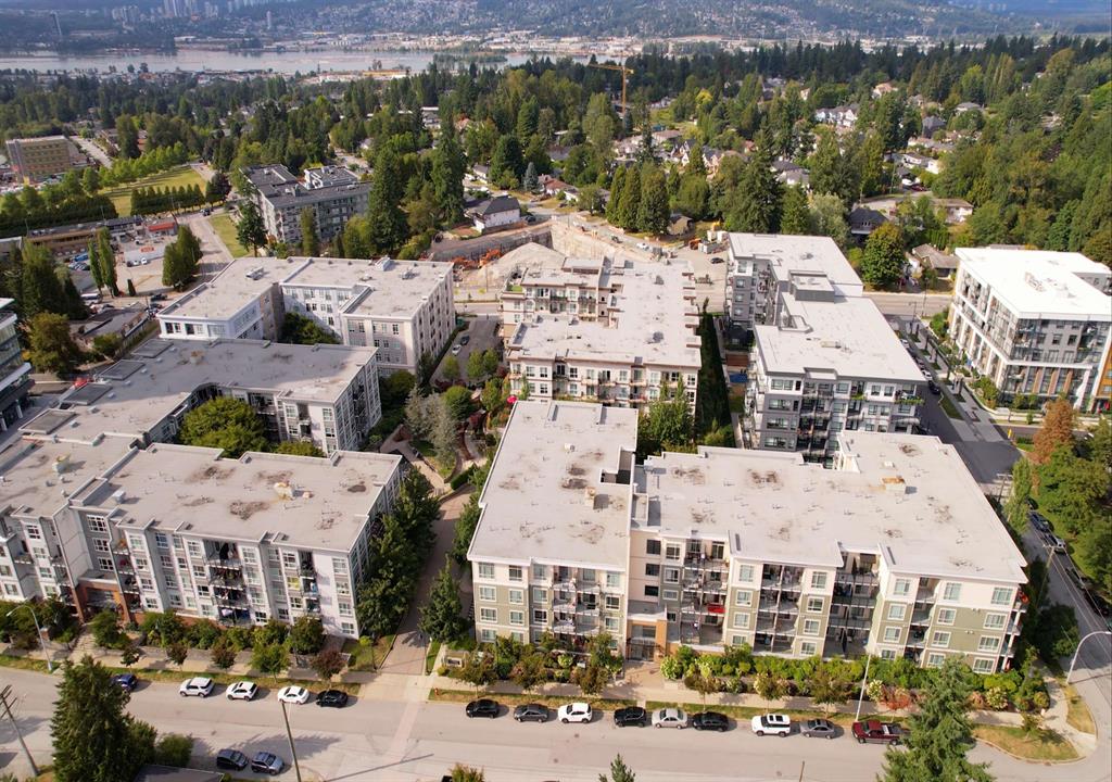 Aerial view of low-rise condos in Whalley, Surrey, with the Fraser River behind
