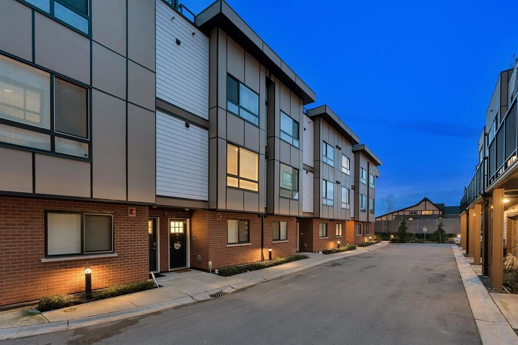 Modern townhomes at dusk in Langley City