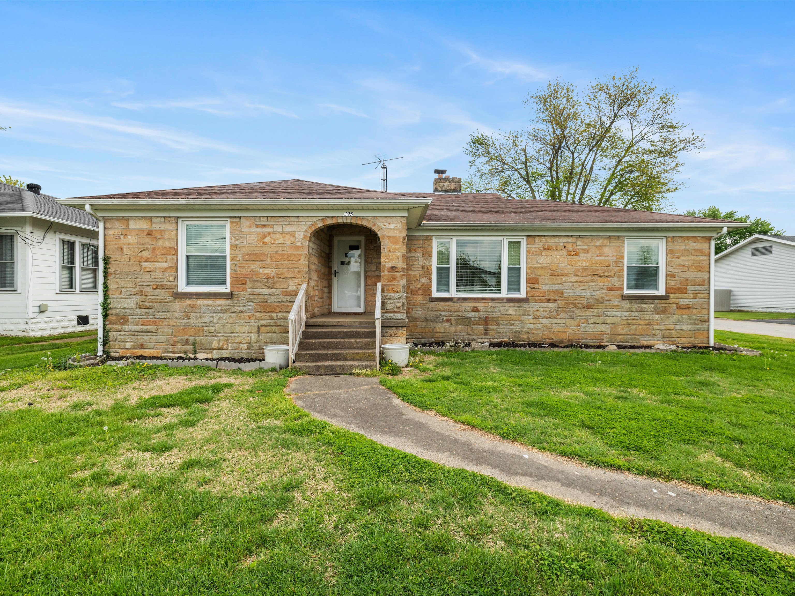 First-time homebuyers Owensboro KY – young couple moving into their new home with real estate agent