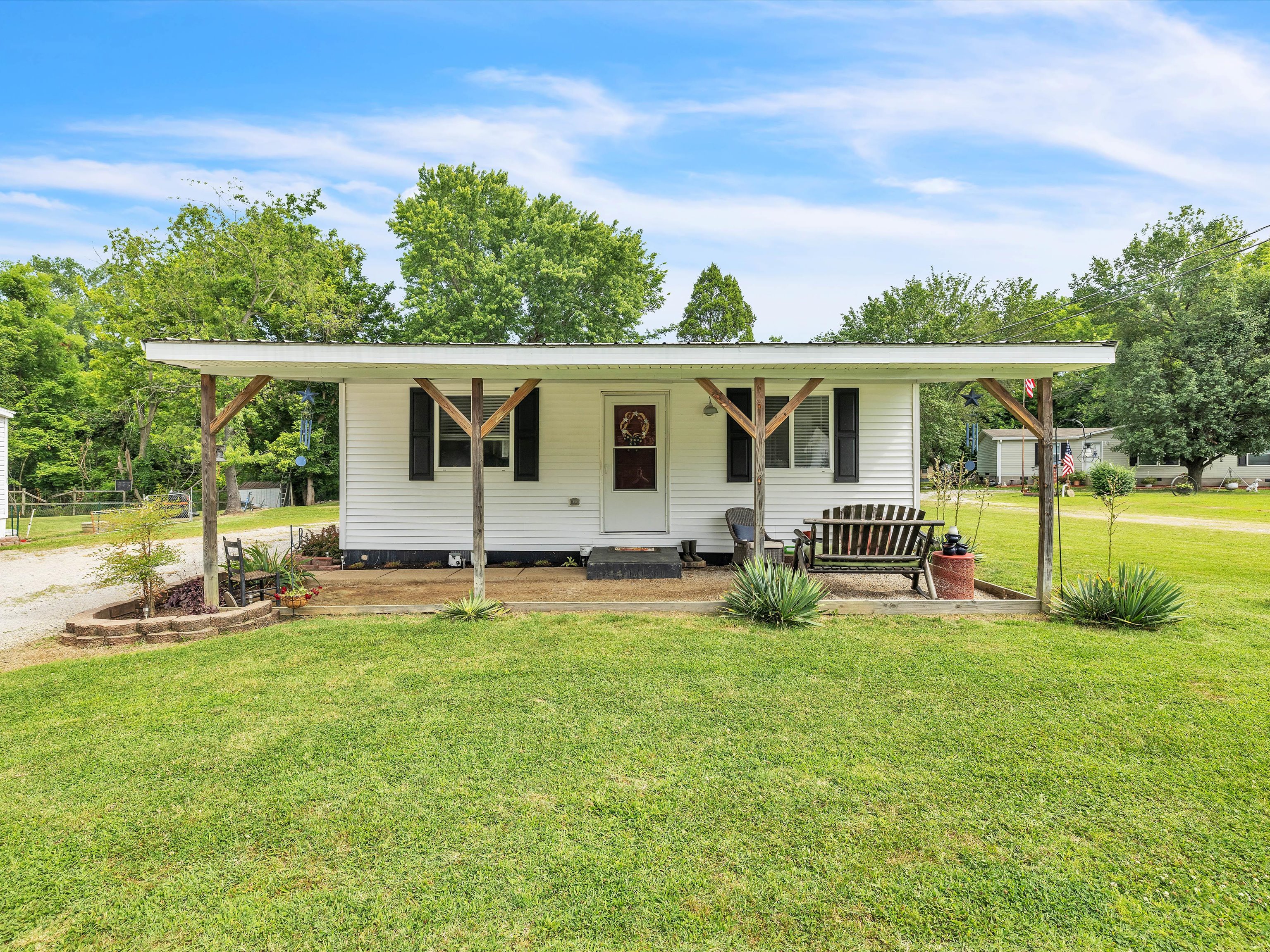 Modern Owensboro KY home exterior with a sold sign in the yard, representing the active real estate market for buyers and sellers.
