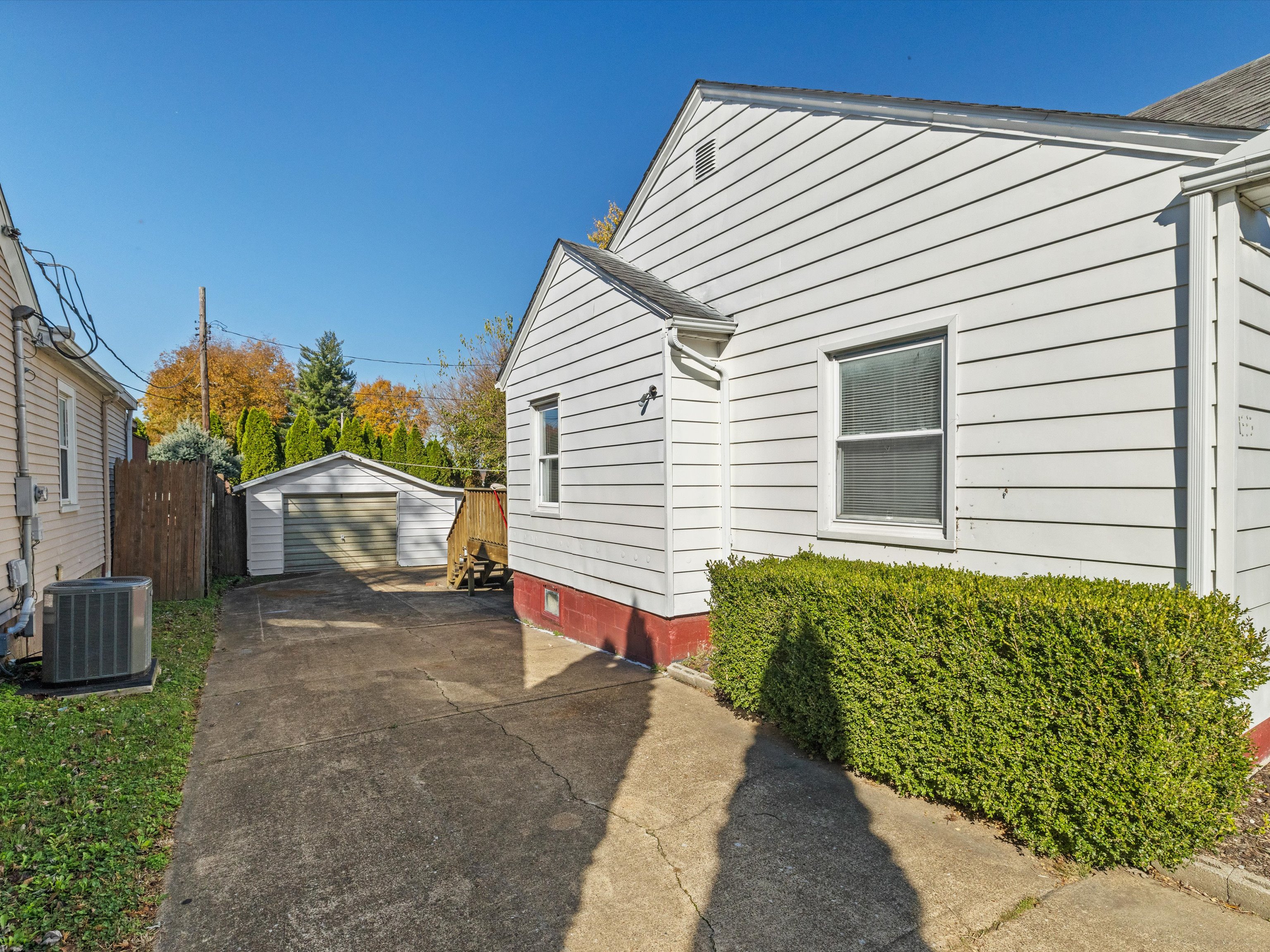 Aerial view of Beaver Dam KY neighborhood with tree-lined streets and family homes – 2025 real estate guide.