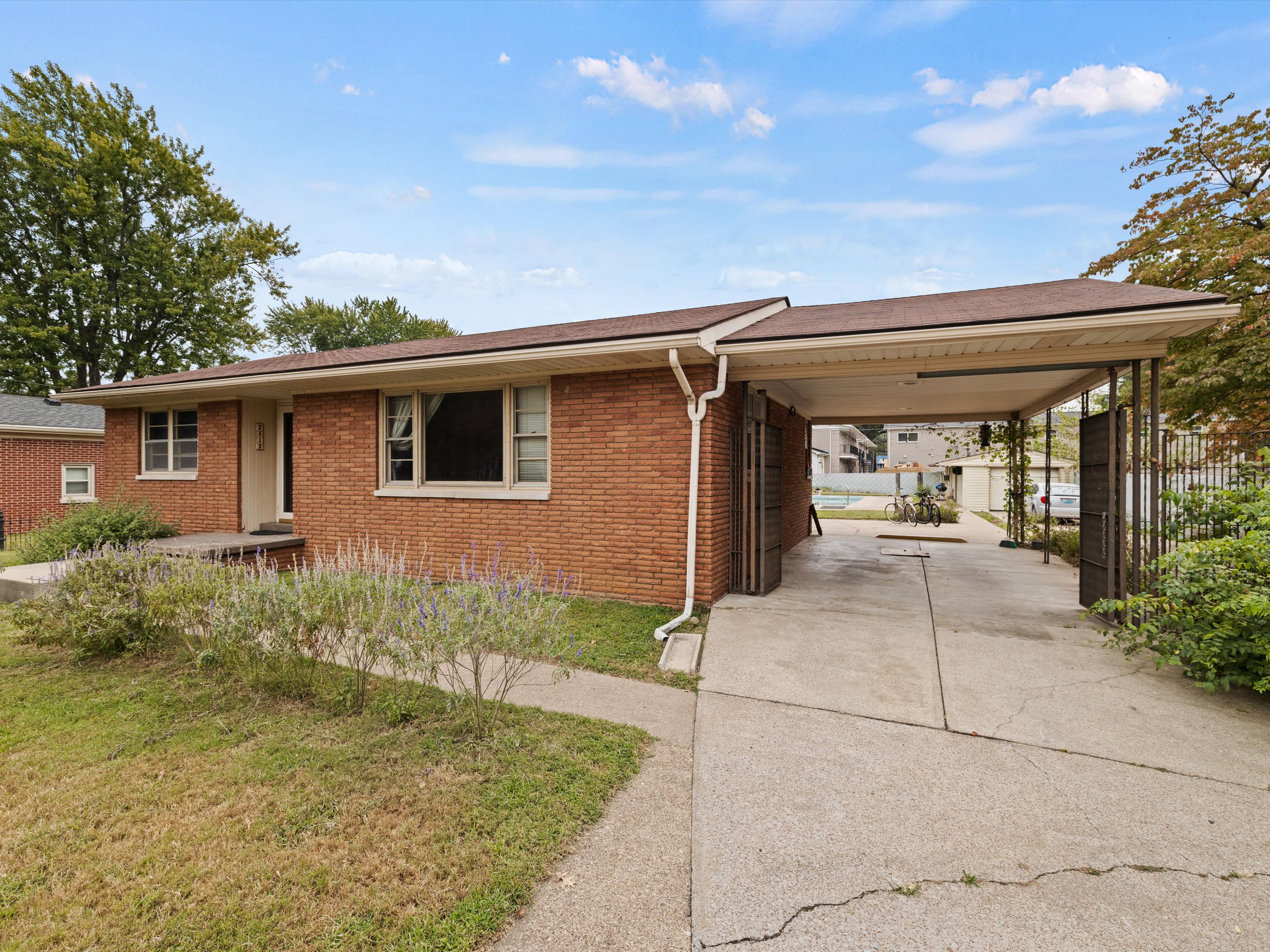 Young couple reviewing low down payment home loan options with a real estate agent in Owensboro, KY.