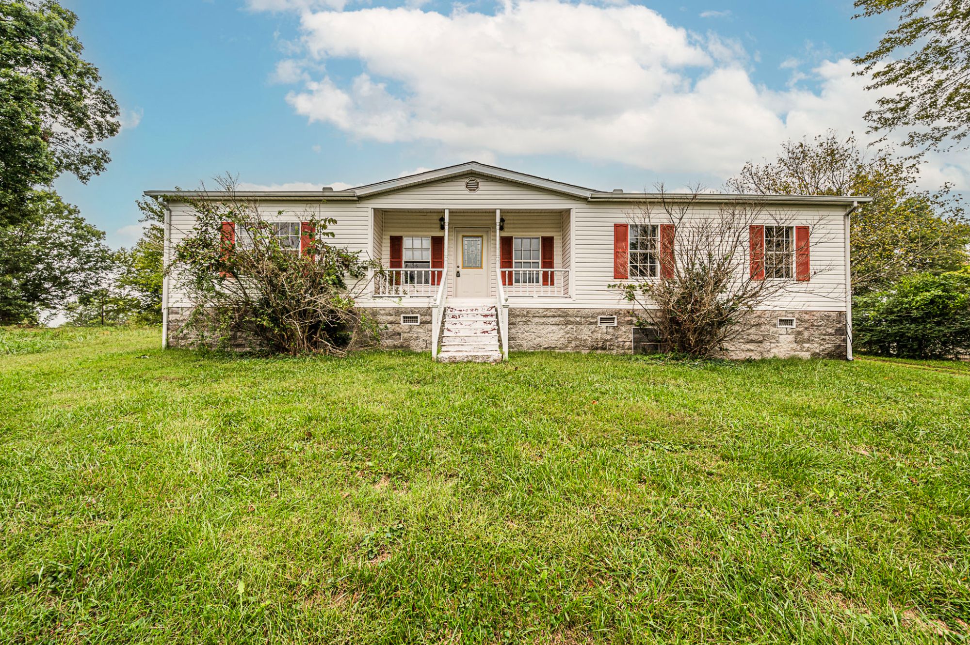 Lewisport KY neighborhood near the Ohio River with single-family homes and a quiet small-town street