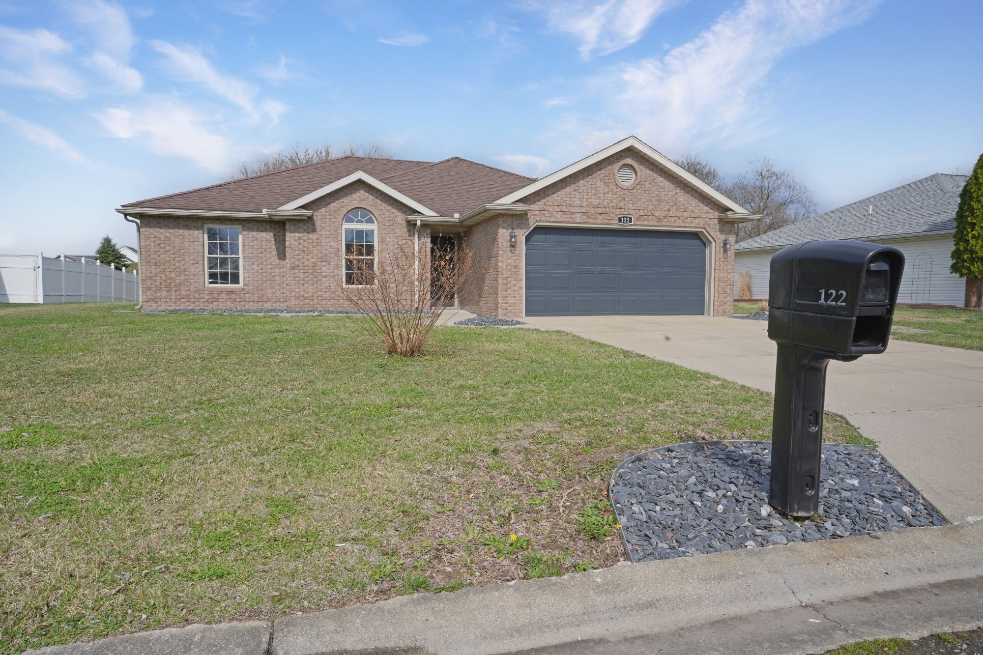 Residential new construction homes in Owensboro KY with modern exteriors and sidewalks in a growing neighborhood