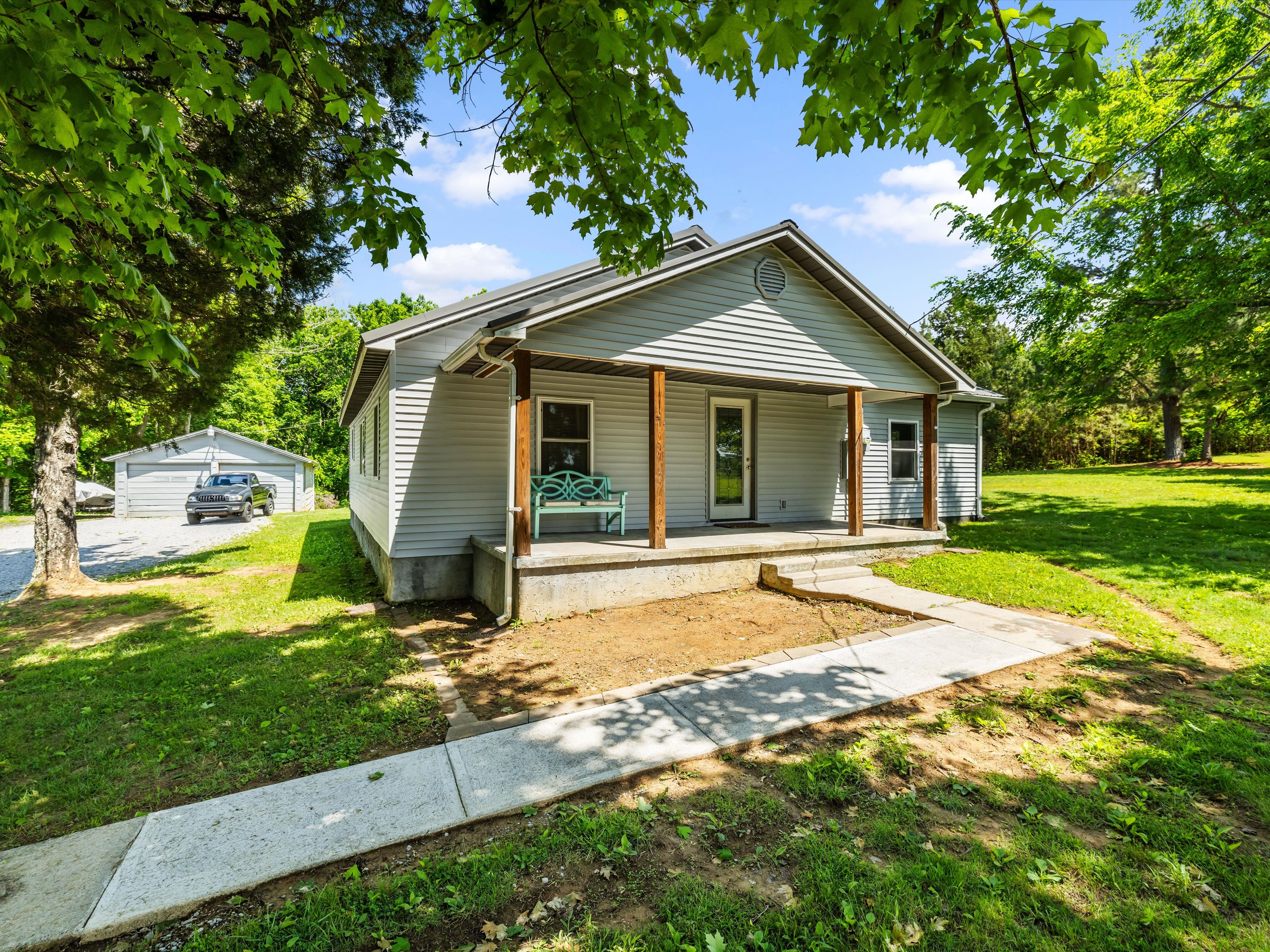 Owensboro KY home seller reviewing a closing statement with a calculator on a kitchen table (Kentucky seller closing costs)