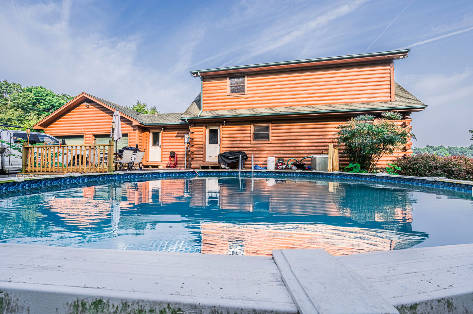 Staged living room in Owensboro KY home with neutral decor, bright windows, and tidy furniture layout