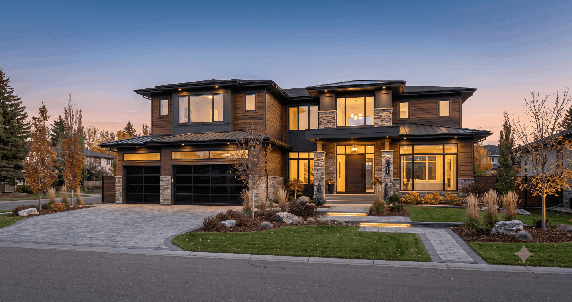 Luxury modern Edmonton home exterior at dusk representing the city's million-dollar real estate market