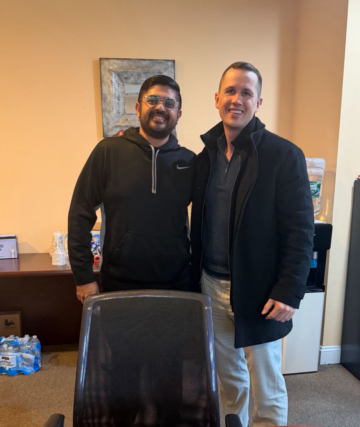 Ryan Destler with a client at the ProLegacy Realty office