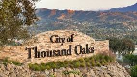 City of Thousand Oaks sign with hills in background