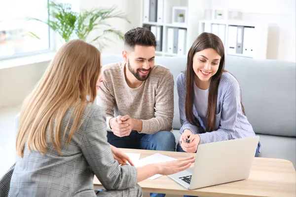 Couple looked at Computer with Agent