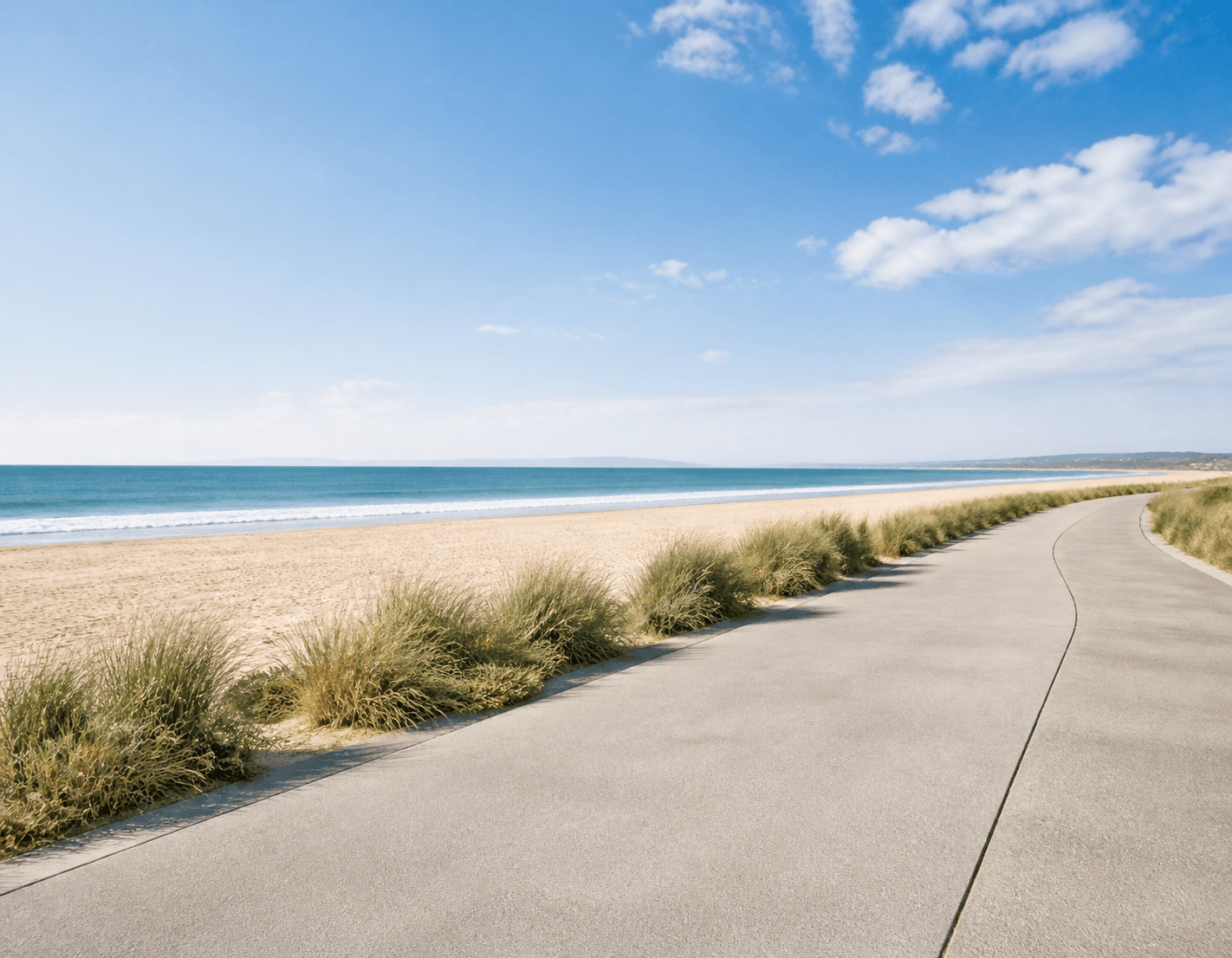 Open coastal bike and walking path along a Huntington Beach shoreline