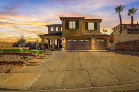 Two-story Henderson, Nevada home at sunset with a three-car garage