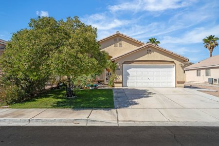 Single-story family home with a two-car garage in a Las Vegas valley neighborhood