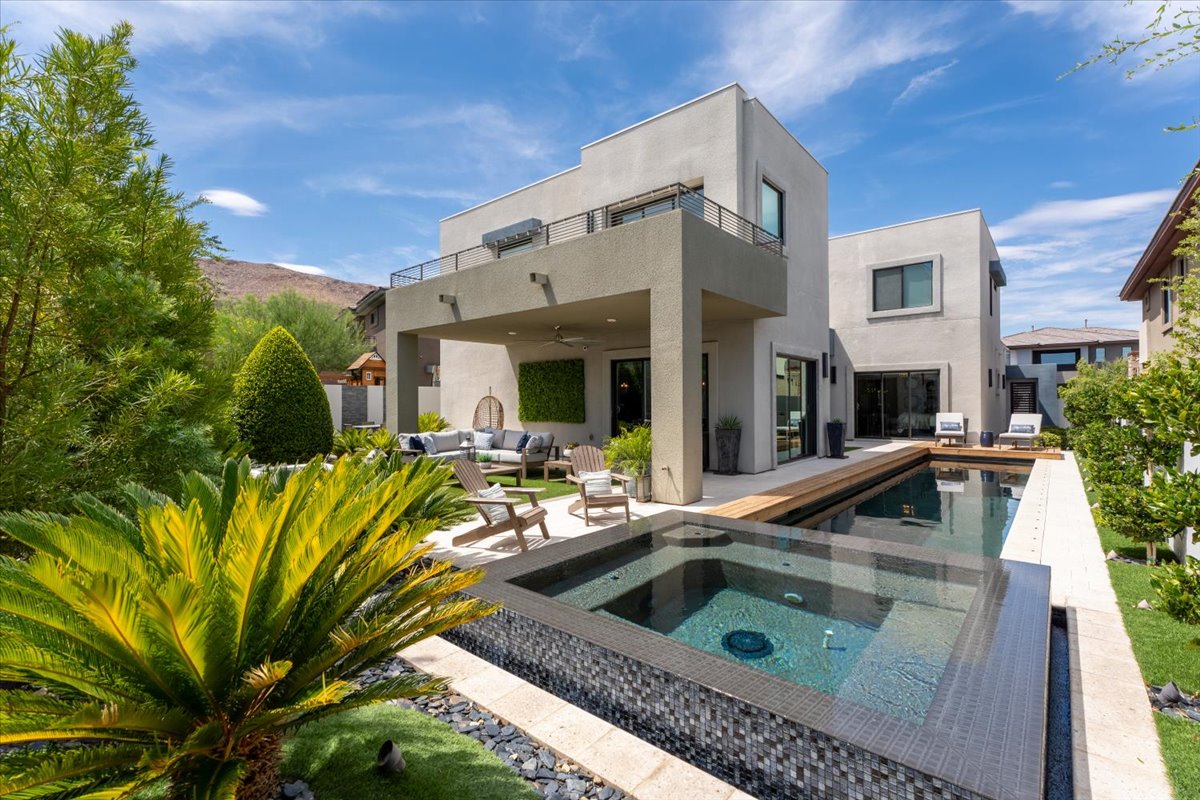 Backyard pool and covered patio of a Las Vegas home represented by Javier Mendez