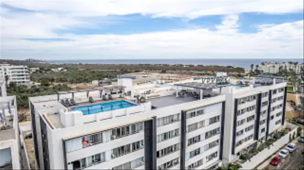 For Sale in Cabo San Lucas: Turnkey Corner Condo with Rooftop Ocean Views