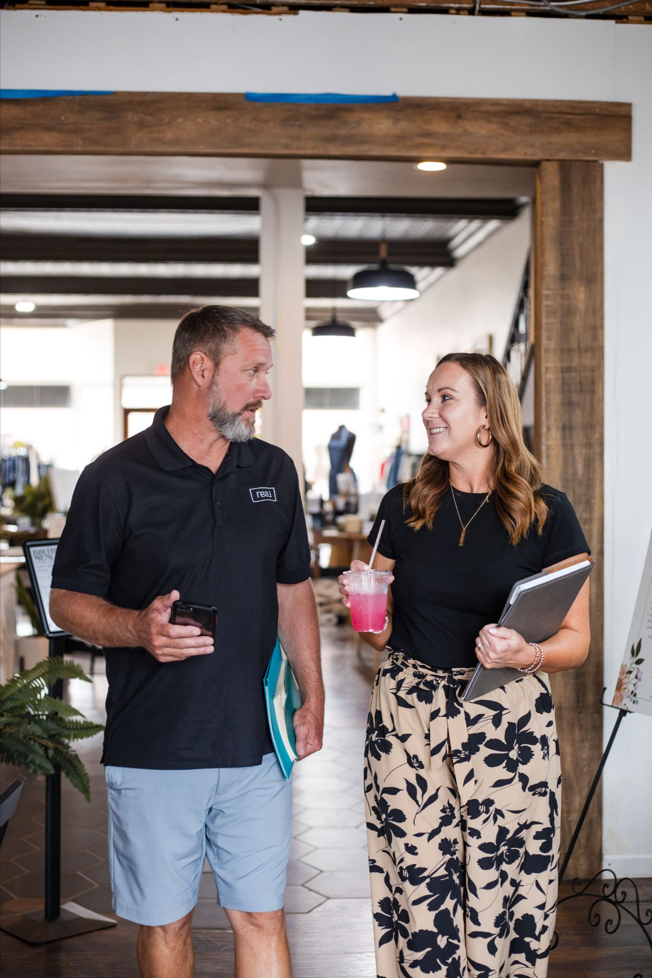 Homebuyers working with a Realtor to review new construction home plans and documents