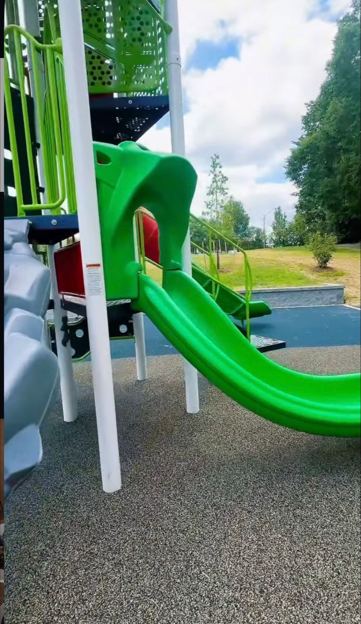 Green slide at the renovated Reston North Park playground