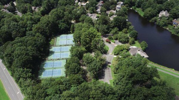 Aerial view of the Lake Newport tennis courts beside the lake