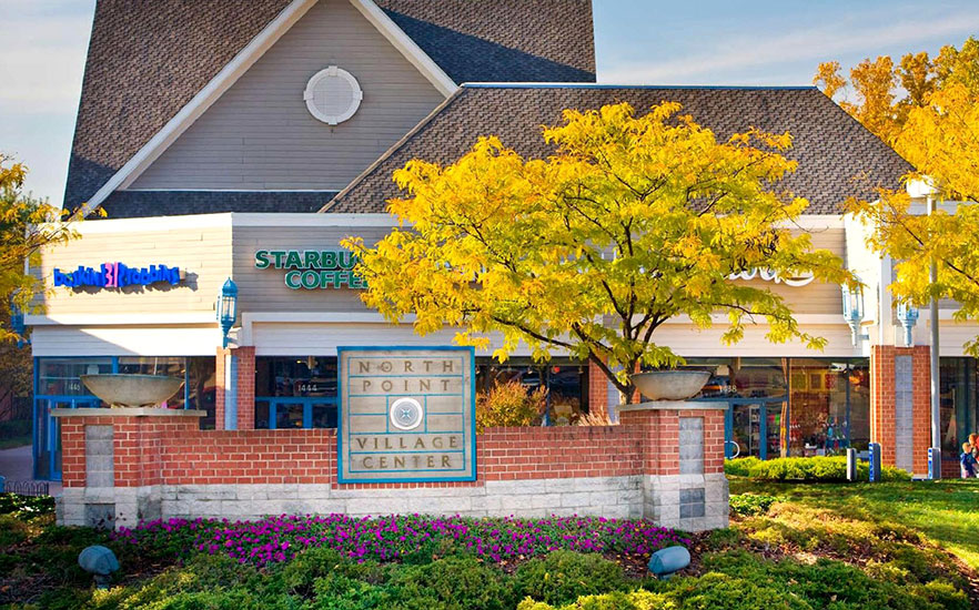 North Point Village Center sign with Starbucks and fall color