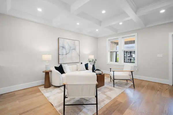 Coffered ceiling and oak floors throughout