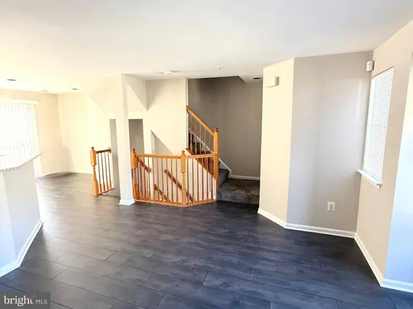 Main level open living space with hardwood