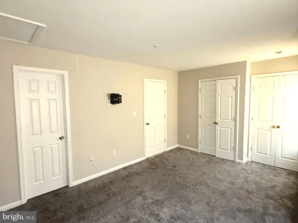 Spacious primary bedroom with attached full bath