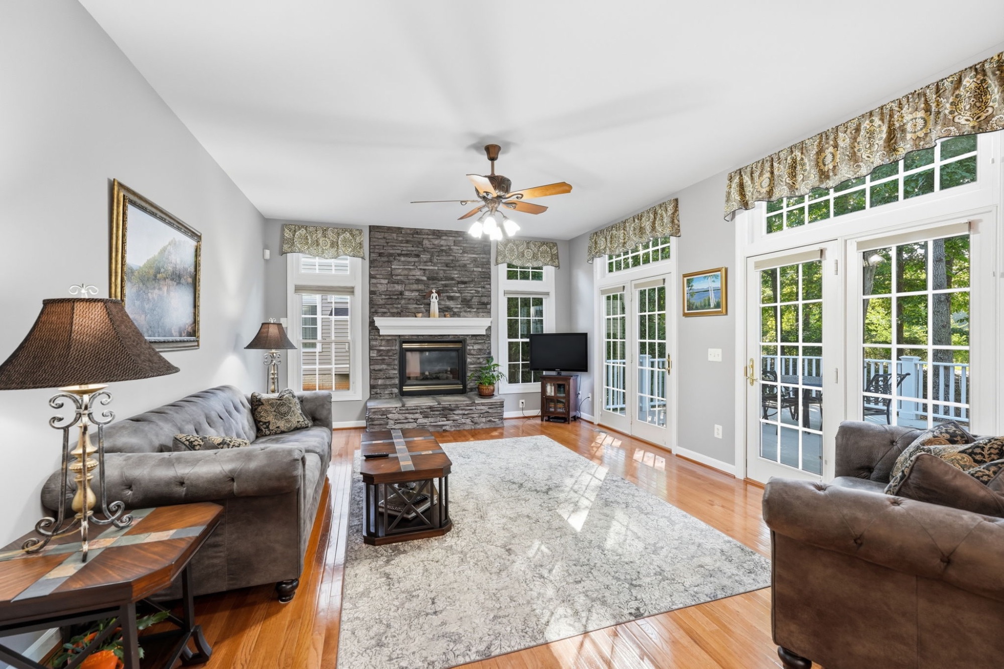 Family room with custom stone fireplace at 14261 Clubhouse Road