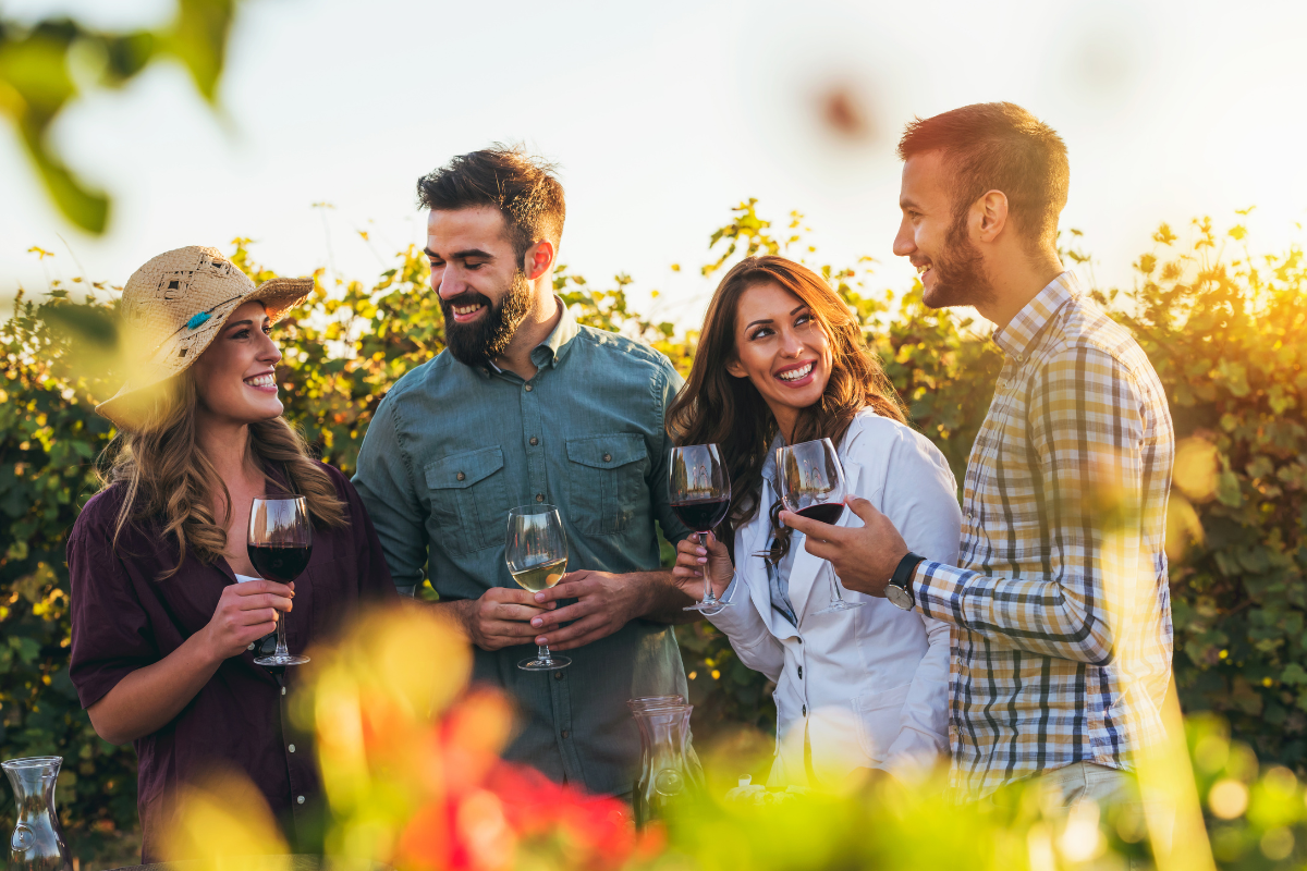 friends toasting at a winery