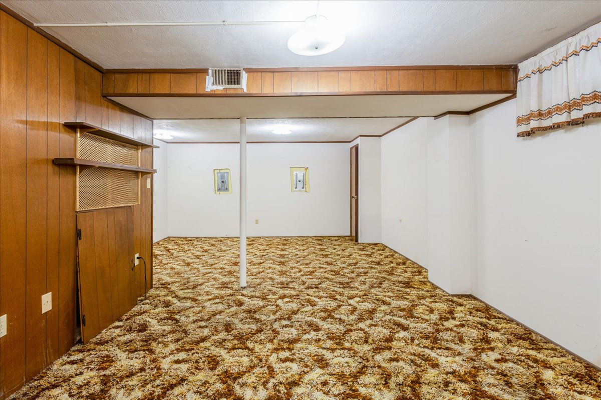 Cleaned-out basement of an Omaha home after a full clutter and hoarding cleanout, ready to list