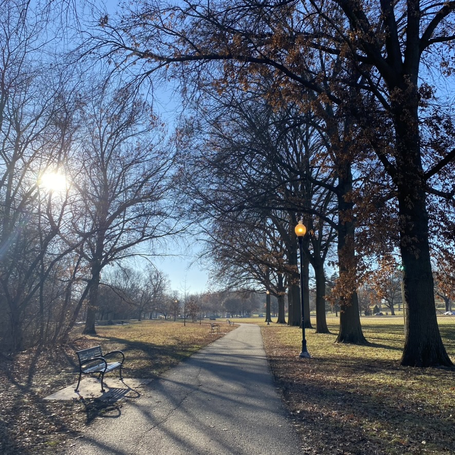 Paved trail winding through Elmwood Park in Omaha's Aksarben neighborhood
