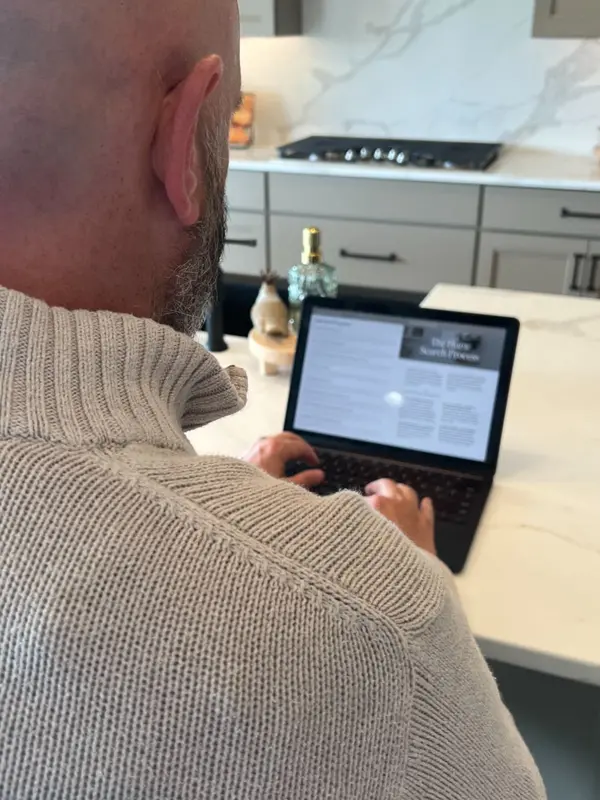 Omaha real estate agent reviewing home pricing data on computer
