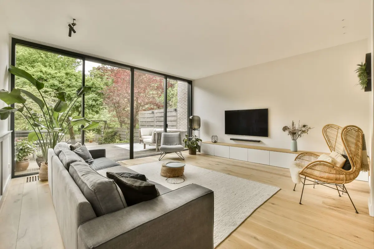 a-living-room-with-a-couch-and-a-large-window-2025-02-10-09-33-54-utc
