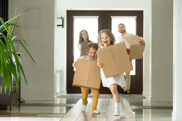 Happy family with kids bought new home