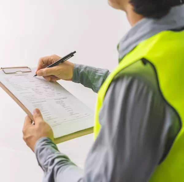 Building inspection, contractor asian young man, male inspecting home, reconstructed construction, renovation or check defect, before finish handing it over to client