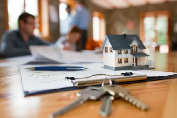 Concept for selling a house and home insurance. Signing a house purchase and sale agreement, housing rental, property insurance. key, house, mortgage, real estate, rent, selling, loan, property