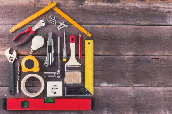 house renovation and improvement DIY tools on old wooden backgro