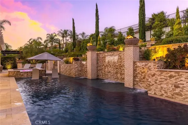 Resort-style backyard with pool, spa, waterfalls and outdoor kitchen – Wolf Creek Temecula home