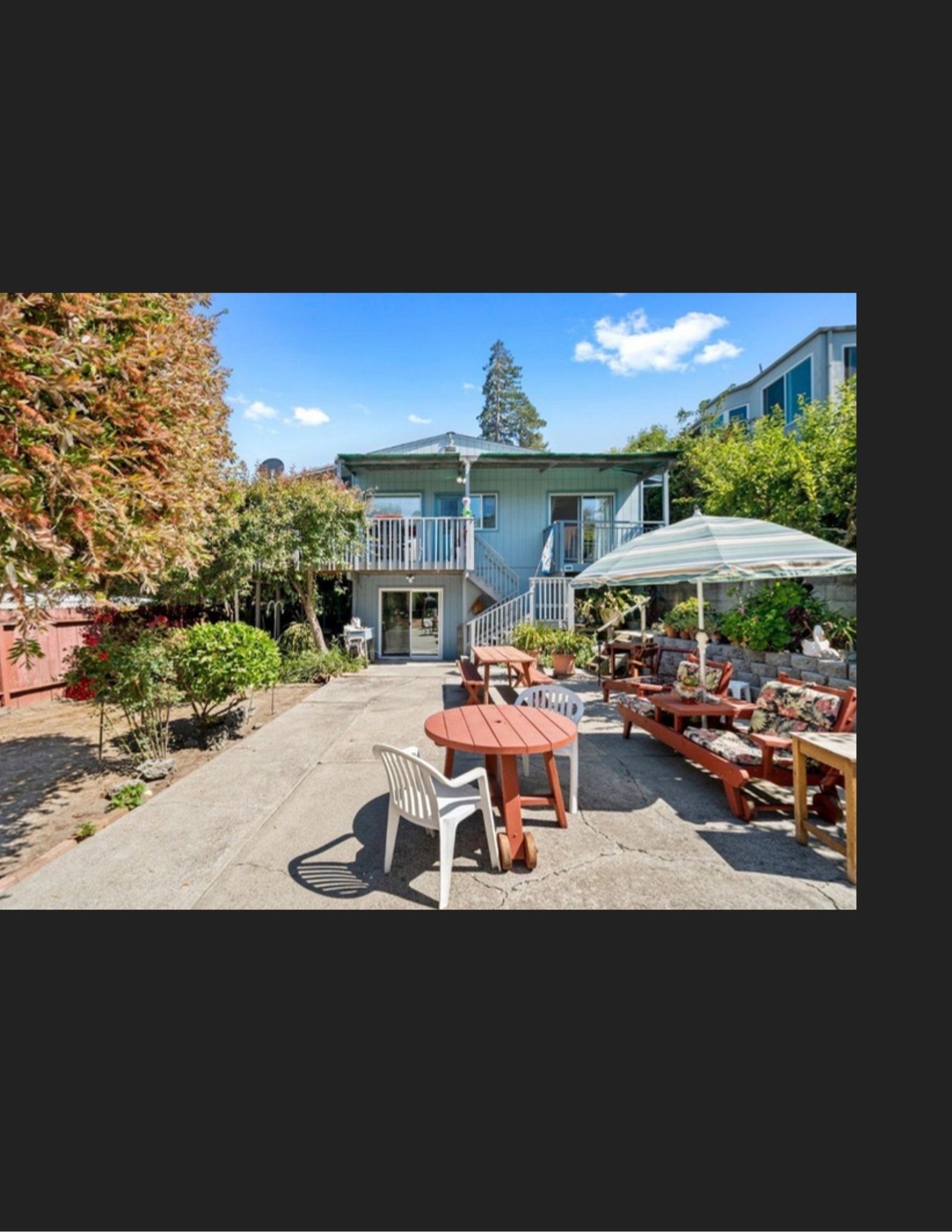 Original backyard patio and rear of the house