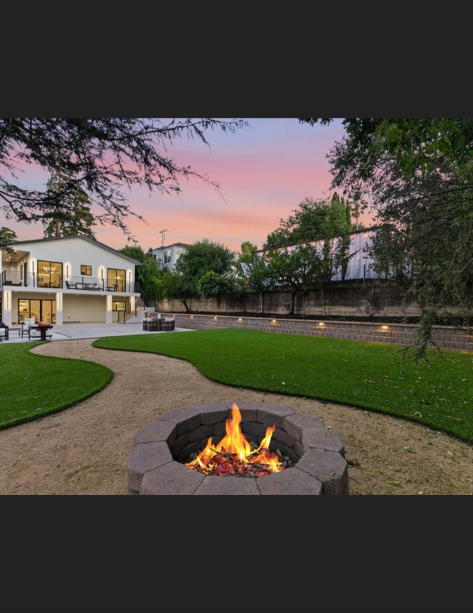 Backyard with fire pit at twilight