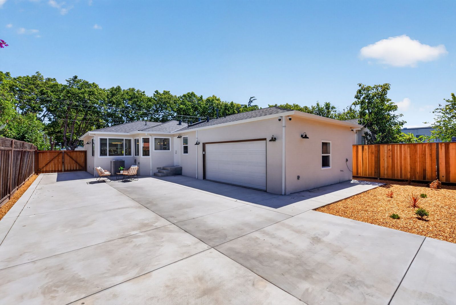 The backyard, new concrete and the garage.