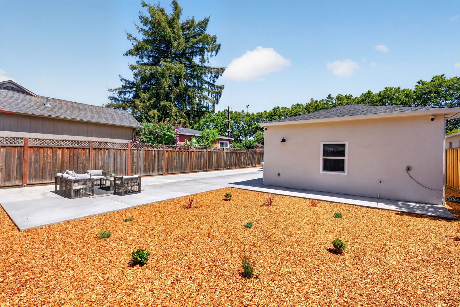 Low maintenance landscaping and the garage at the back of the lot.