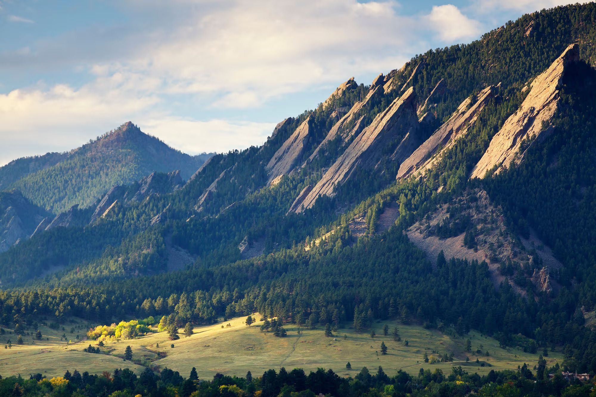 Flatirons mountain backdrop in Boulder, Colorado, showcasing the natural beauty surrounding Boulder real estate.